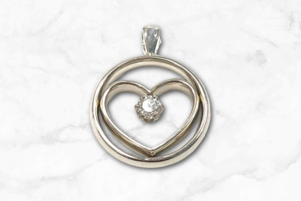 two wedding bands made into heart pendant