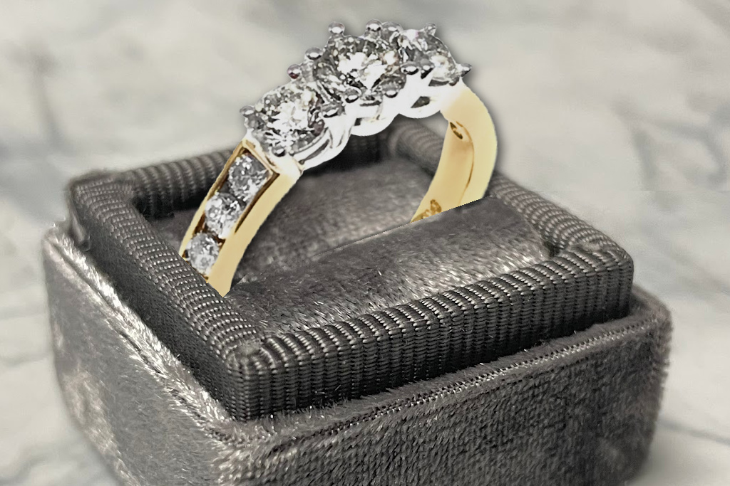 three stone ring with channel set accents