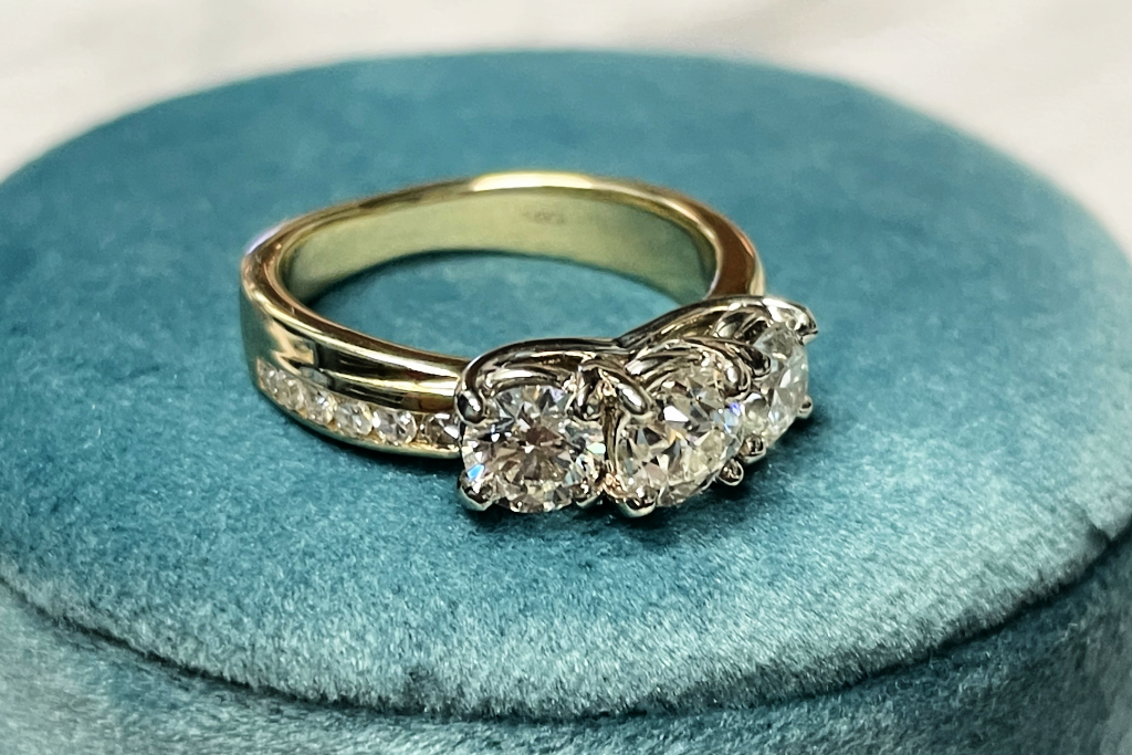 Barb three stone bypass engagement ring